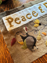 PEACE & PROSPERITY WOOL APPLIQUE TABLE MAT