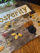 PEACE & PROSPERITY WOOL APPLIQUE TABLE MAT