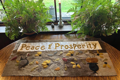 PEACE & PROSPERITY WOOL APPLIQUE TABLE MAT